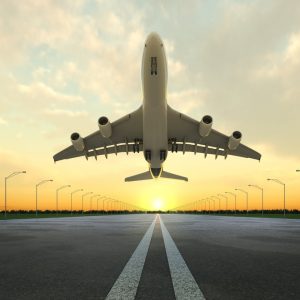 takeoff plane in airport at sunset